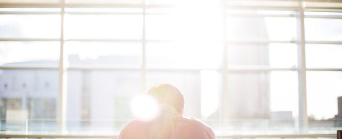 Man working in front of a window