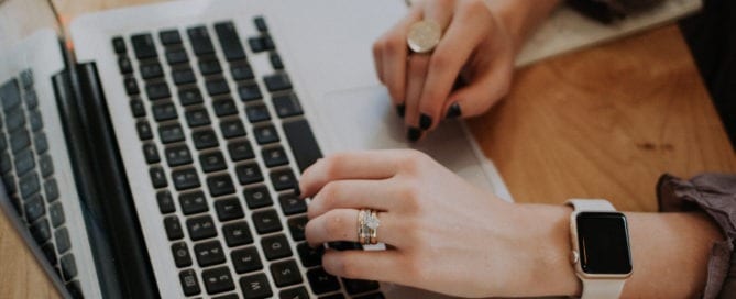 Woman typing at her laptop