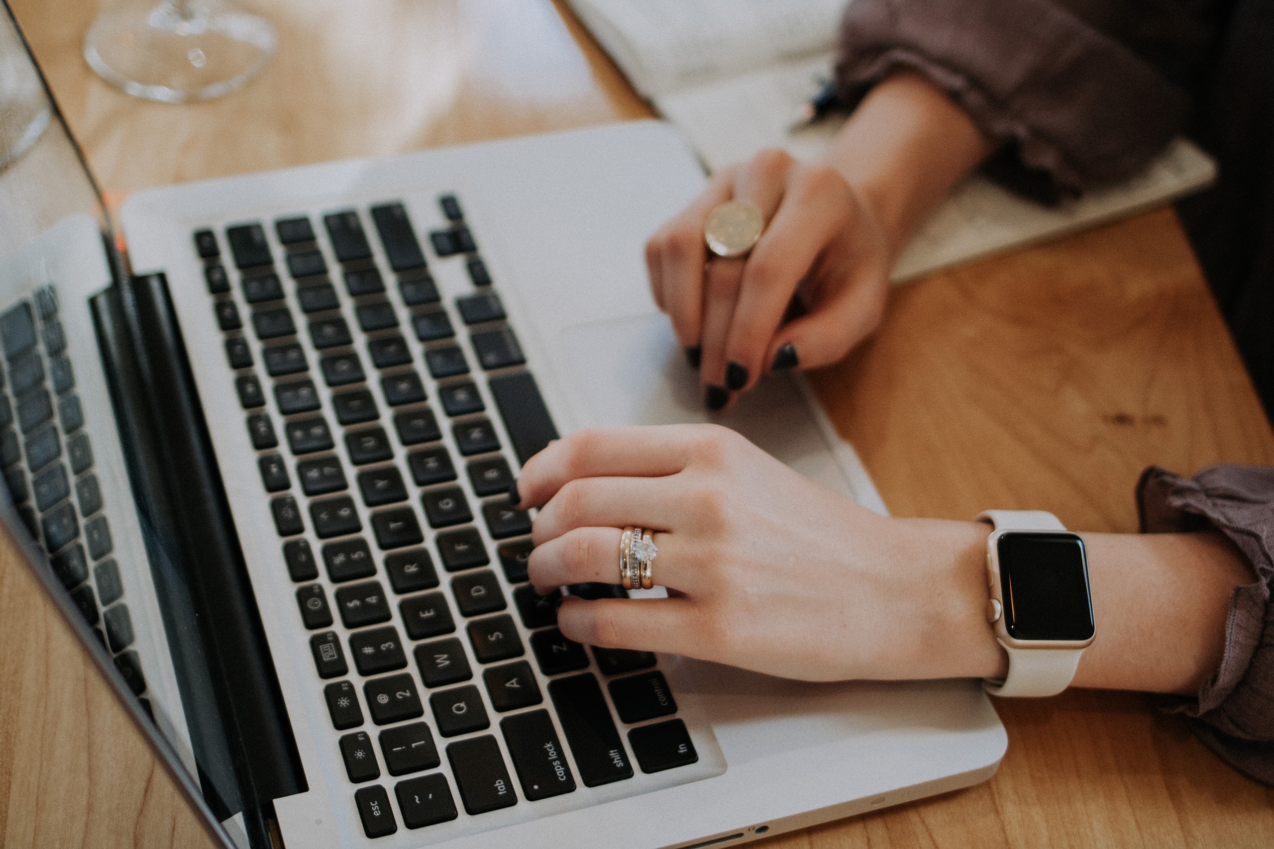 Woman typing at her laptop