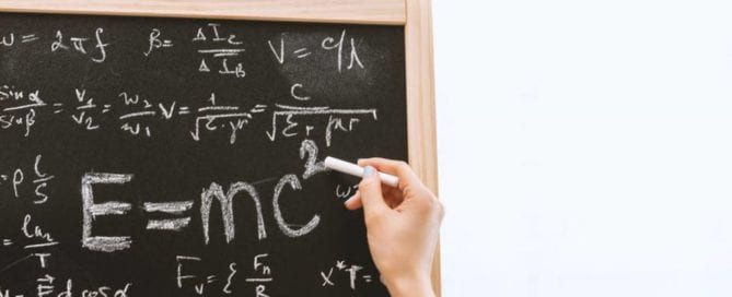 handwriting on chalkboard with equation